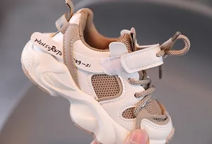 Detailed close-up of children winter sports shoes with warm lining and mesh texture