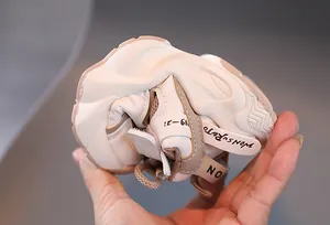 Detail showing the ultra-flexible soft sole of the warm winter kids sneaker being bent