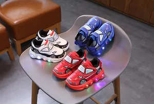 Three pairs of racing-style kids LED sneakers with glowing soles and car-shaped design