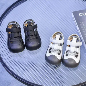 Close-up of mesh hollow-out toddler sandals with reinforced toe caps and Velcro straps