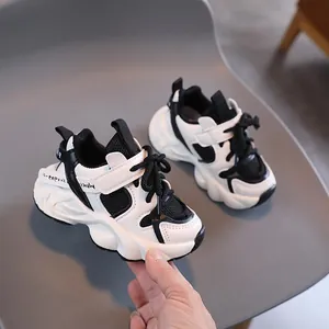 Winter children's warm plush sports shoes with thick non-slip soles in black and white