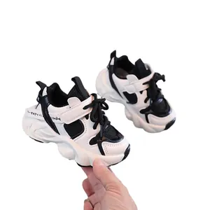 Kids black and white chunky sneakers with warm lining and wave-shaped thick rubber soles