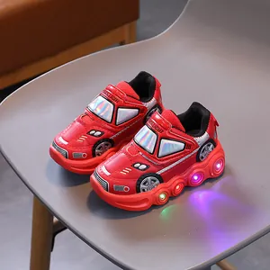 Red racing car style kids LED sneakers with light-up soles and velcro straps for boys