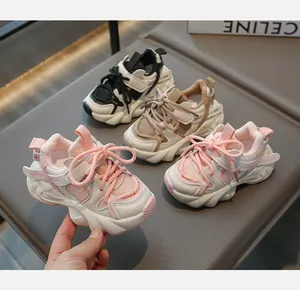Detailed view of pink, beige and black mesh breathable sneakers for kids with thick rubber soles