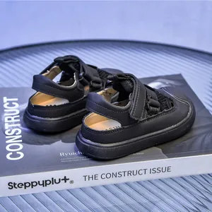 Detail of children's black breathable mesh sandals with double hook-and-loop fasteners
