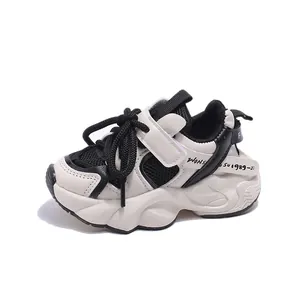 Kids chunky sneakers in beige and black with mesh breathable panels and velcro strap