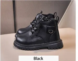 Detail view of black leather kids boots with side zipper, laces and non-slip rubber soles