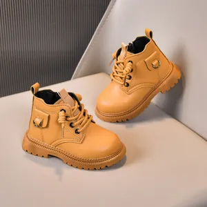 Detailed view of yellow kids' leather boots featuring side zipper and non-slip rubber soles