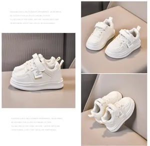 Detailed macro view of white children's sneakers with velcro closure and breathable toe box