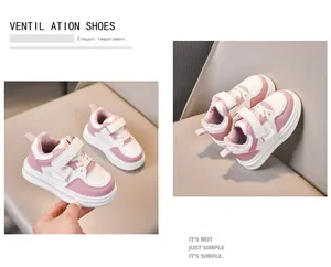 Detail of pink and white kids sneakers with Velcro straps and CLDB SPORT logo