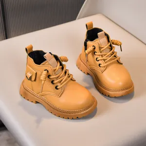 Close-up of yellow children's martin boots with side zipper and durable rubber sole