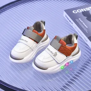 Scarpe luminose a LED per bambini bianche con inserti arancioni e chiusura a strappo