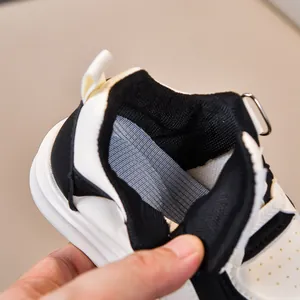 Detailed close-up of breathable honeycomb lining and padded collar on kids' sneakers