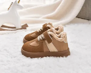 Detail of warm faux shearling lining and suede upper on winter kids sneakers
