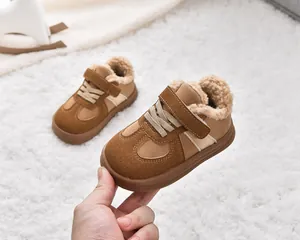 Detailed macro view of warm faux fur lining inside these brown winter sneakers for kids
