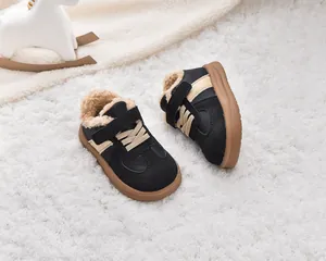 Close-up of children's winter sneakers with warm plush lining and non-slip rubber soles
