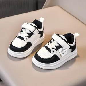 Classic black and white kids' thermal sneakers with velcro strap and thickened rubber sole