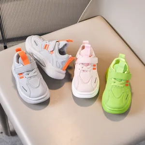 Kids non-slip sneakers in grey pink and green with velcro straps and thick soft soles