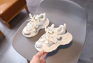 Detail of kids mesh sneakers with velcro strap and thick anti-slip sole for running