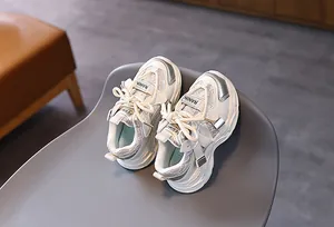 Detail of children's mesh sneakers with silver accents and durable hook-and-loop straps