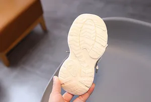 Close-up of anti-slip rubber sole with size 28 engraving on kids mesh sneakers