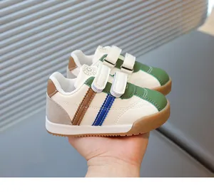 Close-up of children sneakers with double hook-and-loop straps and durable rubber sole