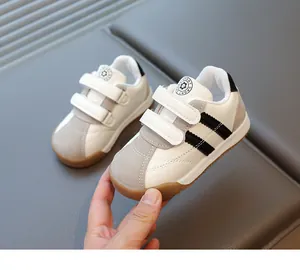 Detail of toddler sneakers with double velcro straps and anti-slip rubber sole