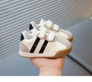 Detail of waterproof leather kids sneakers with rubber sole and double hook-and-loop closure