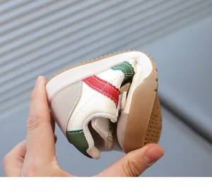 Close-up showing the high flexibility and non-slip rubber sole of the retro kids sneaker