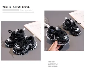 Detail of breathable black kids sneakers featuring thick anti-slip soles and mesh fabric
