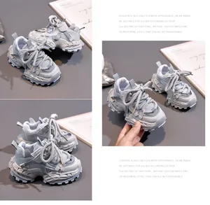 Close-up of children's grey thick-sole sneakers with mesh texture and thick rope laces