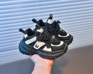 Detailed shot of breathable mesh and slip-resistant rubber sole on kids' sneakers
