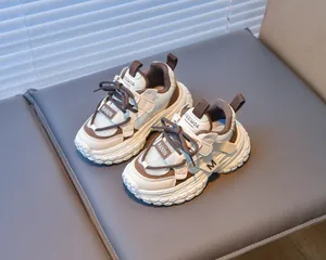 Detail of children's chunky sneakers featuring breathable mesh and textured non-slip soles