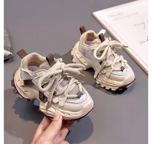 Detail view of children's chunky sneakers with mesh upper and slip-resistant rubber soles