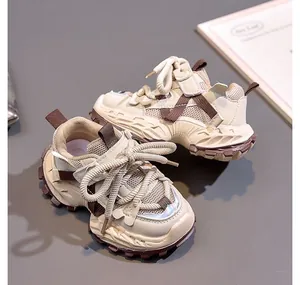 Close-up of children's thick-soled dad sneakers with breathable mesh and rugged grip