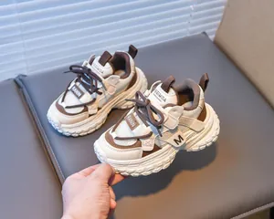 Detailed view of breathable mesh and thick anti-slip sole on children sports sneakers