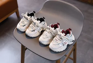 Detail view of boys' breathable mesh sneakers in black-white and red-white colorways