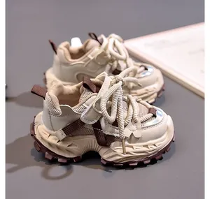 Top-down view of stylish children's mesh sneakers with thick non-slip soles and velcro straps
