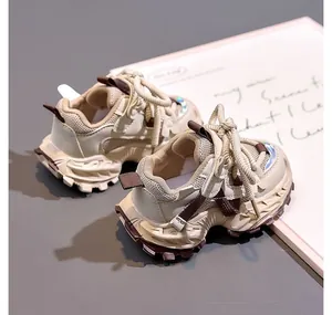 Detailed close-up of children's thick-soled sneakers with mesh and leather panels