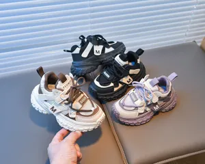 Detail view of breathable mesh and faux leather material on children's chunky sneakers