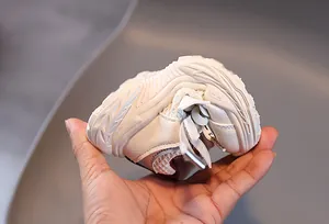 Detailed view showing the flexible soft sole of breathable mesh kids sneakers