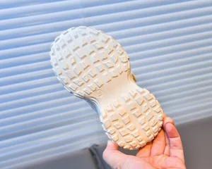 Detailed view of durable thick anti-slip sole on kids breathable sneakers size 28