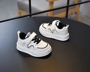 Close-up of kids leather sneaker with 1987 strap detail and breathable toe box