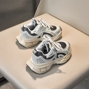 Detailed macro view of kids mesh sports sneakers with breathable leather and fabric stitching