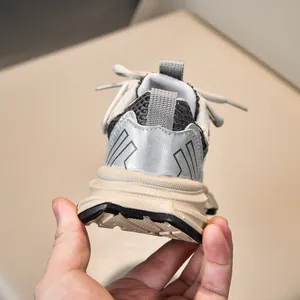 Detailed back view of children's breathable mesh sneakers with chunky rubber soles