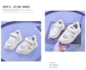 Detail of white breathable mesh kids sneakers with hook-and-loop closure and thick sole