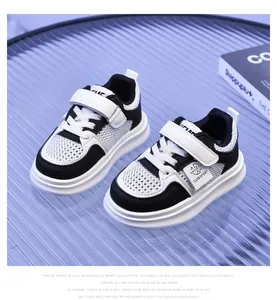 Detail view of children's breathable mesh sneakers with hook and loop closure design