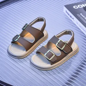Detail view of brown toddler Birkenstock-style sandals with triple adjustable buckles