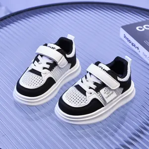 Detail view of children's breathable mesh sneakers with hook-and-loop closure