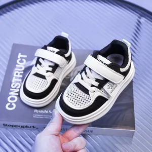 Macro detail of breathable mesh fabric and hook-and-loop closure on kids' sneakers